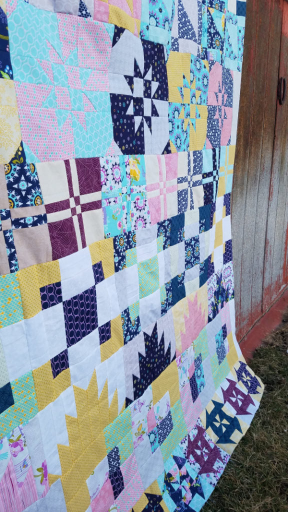 The Disappearing Row Along is a free quilt along! You'll sew up disappearing quilt blocks all year long! 64x80 row quilt Explore this fun technique.