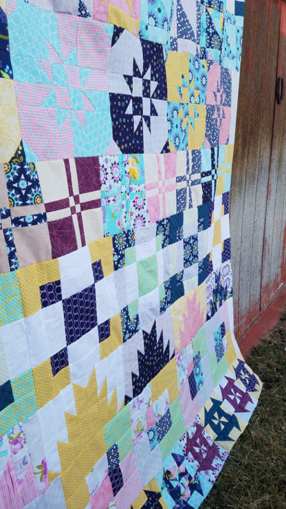 The Disappearing Row Along is a free quilt along! You'll sew up disappearing quilt blocks all year long! 64x80 row quilt Explore this fun technique.