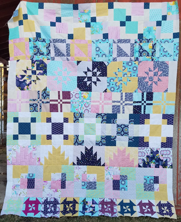 The Disappearing Row Along is a free quilt along! You'll sew up disappearing quilt blocks all year long! 64x80 row quilt Explore this fun technique.